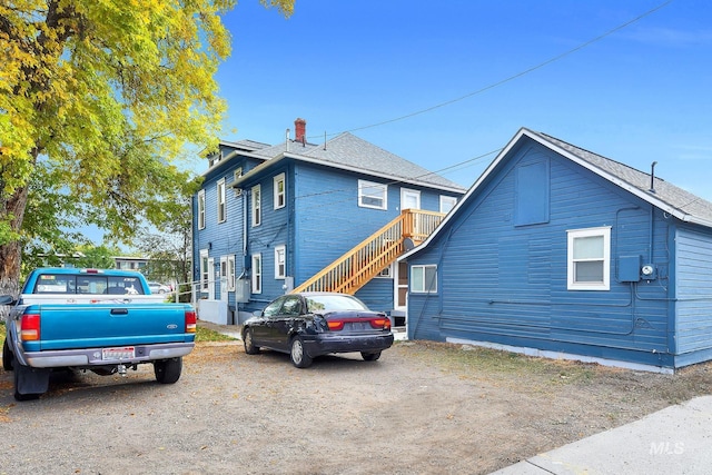 405 N 2nd E, Mountain Home, ID 83647 - view of property exterior featuring a chimney and stairs