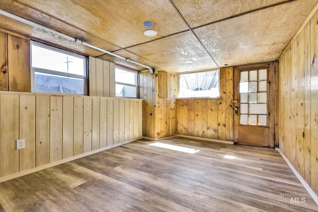 405 N 2nd E, Mountain Home, ID 83647 - unfurnished room featuring wood finished floors and wooden walls