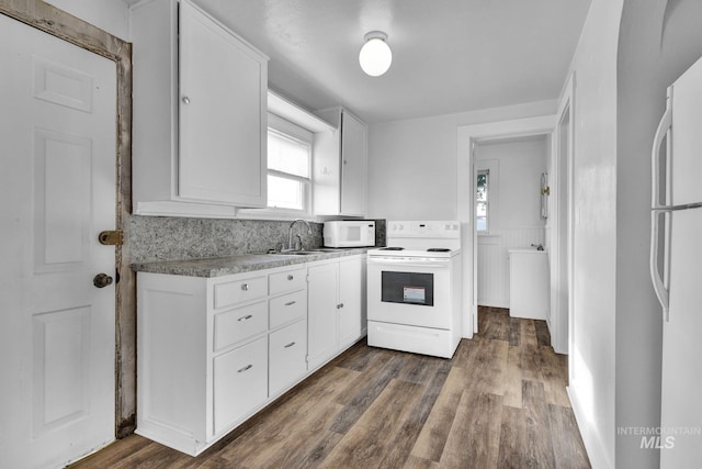 405 N 2nd E, Mountain Home, ID 83647 - kitchen with white appliances, a sink, white cabinetry, and dark wood-style floors