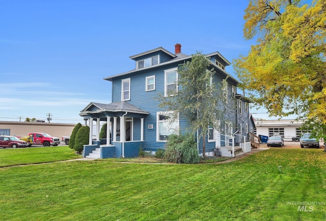 405 N 2nd E, Mountain Home, ID 83647 - traditional style home featuring a front lawn and a chimney