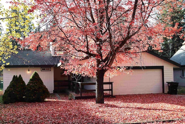 view of side of property with a garage