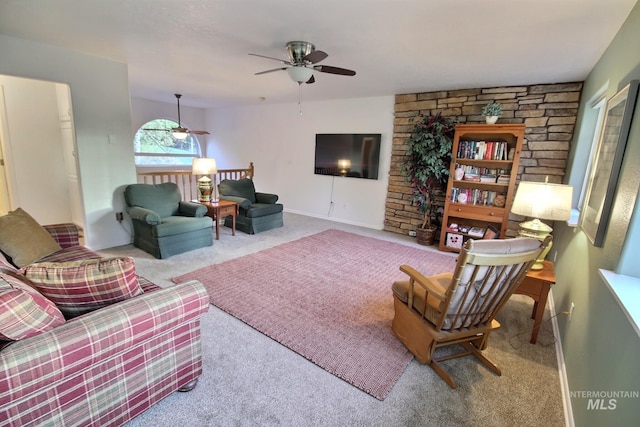 carpeted living room featuring ceiling fan