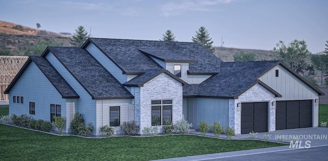 view of front facade featuring a garage and a front lawn