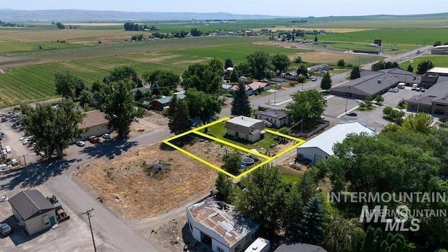 birds eye view of property featuring a rural view and a residential view