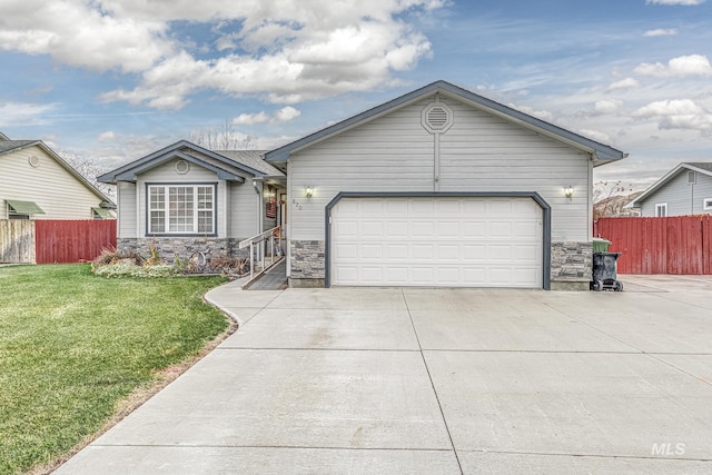 ranch-style home with a garage and a front lawn