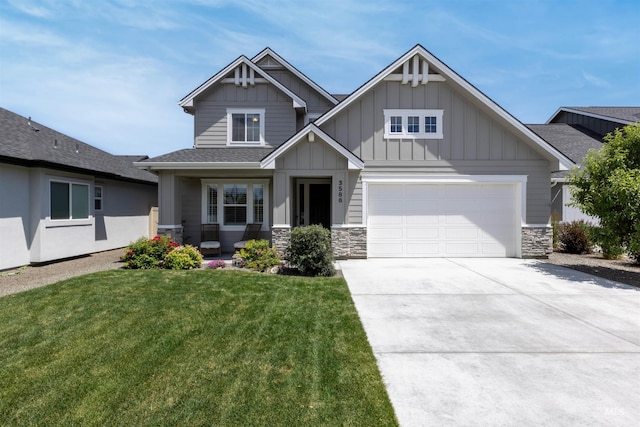 3588 S Taradale Ave, Boise, ID 83709 - craftsman-style house with board and batten siding, a front yard, driveway, stone siding, and an attached garage