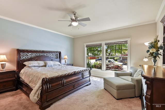 bedroom featuring ceiling fan, crown molding, and light carpet