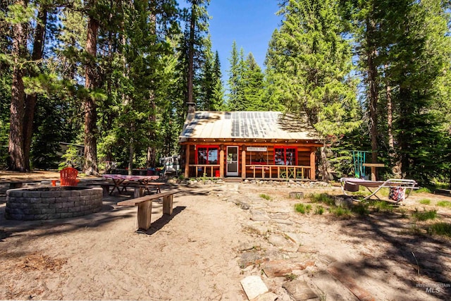 exterior space with an outdoor fire pit