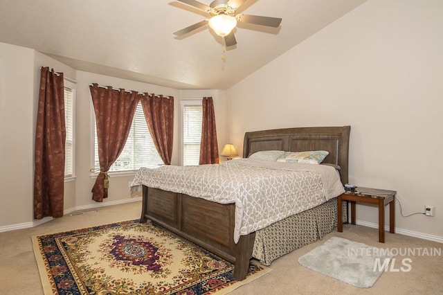 bedroom featuring a ceiling fan, carpet flooring, vaulted ceiling, and baseboards