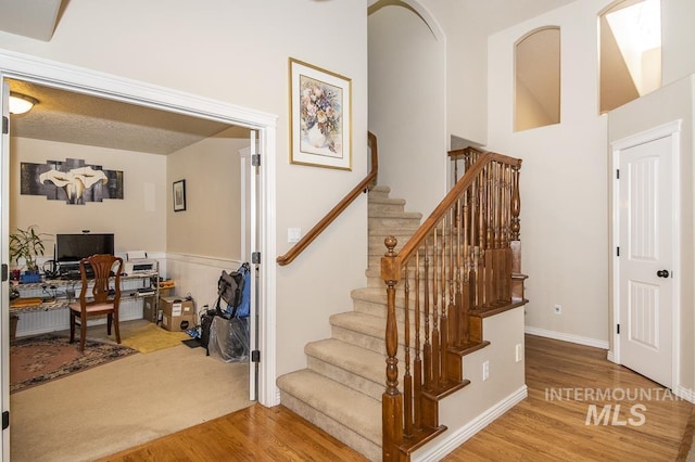 stairs with wood finished floors