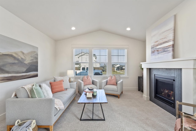 living room featuring baseboards, a tiled fireplace, light colored carpet, vaulted ceiling, and recessed lighting