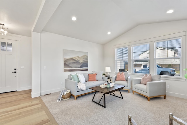 living room featuring lofted ceiling, baseboards, light wood finished floors, and recessed lighting