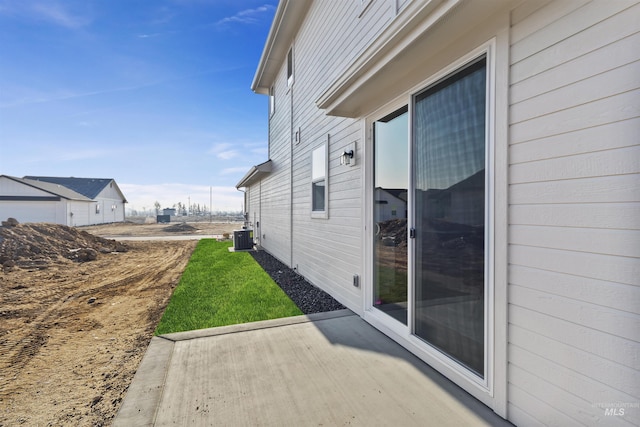 view of side of property with cooling unit