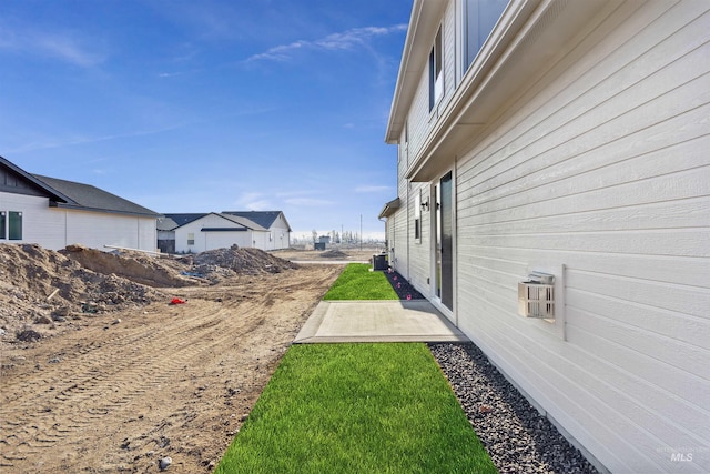 view of yard with central AC unit