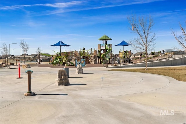 view of home's community with playground community and fence