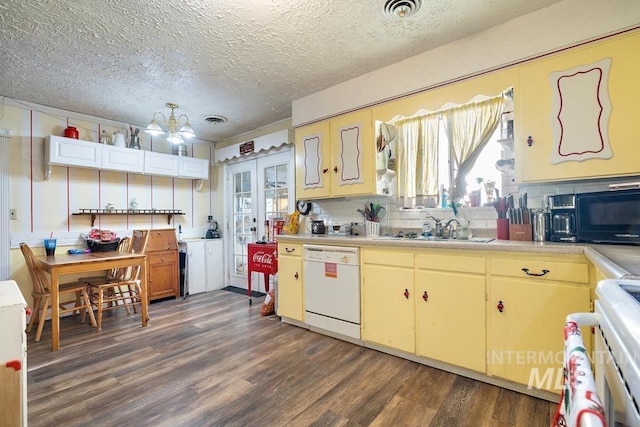 kitchen with sink, white dishwasher, dark wood-type flooring, a textured ceiling, and french doors