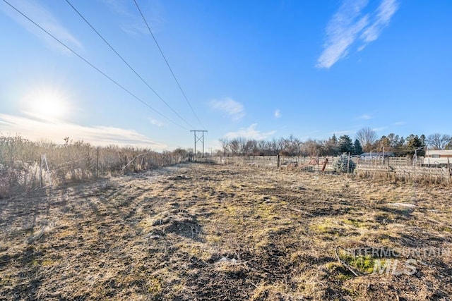 view of yard with a rural view