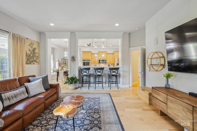 327 E Rockingham Dr, Eagle, ID 83616 - living area featuring plenty of natural light, recessed lighting, light wood finished floors, and baseboards