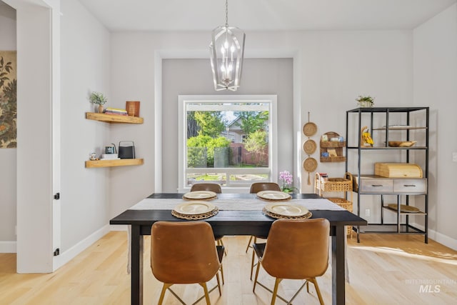 327 E Rockingham Dr, Eagle, ID 83616 - dining room with light wood-style flooring and baseboards