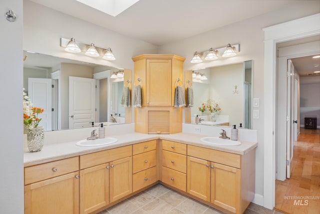 327 E Rockingham Dr, Eagle, ID 83616 - bathroom with double vanity and a skylight