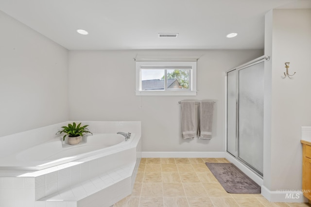 327 E Rockingham Dr, Eagle, ID 83616 - bathroom featuring a shower stall, a bath, vanity, and baseboards
