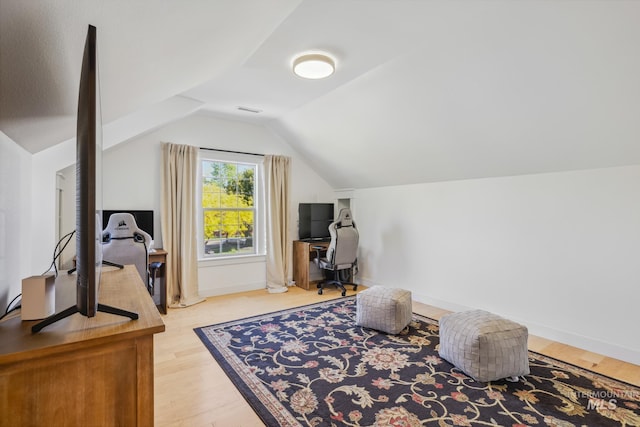 327 E Rockingham Dr, Eagle, ID 83616 - office area with lofted ceiling, wood finished floors, and baseboards