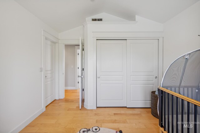 327 E Rockingham Dr, Eagle, ID 83616 - bedroom with vaulted ceiling, light wood-type flooring, a closet, and baseboards