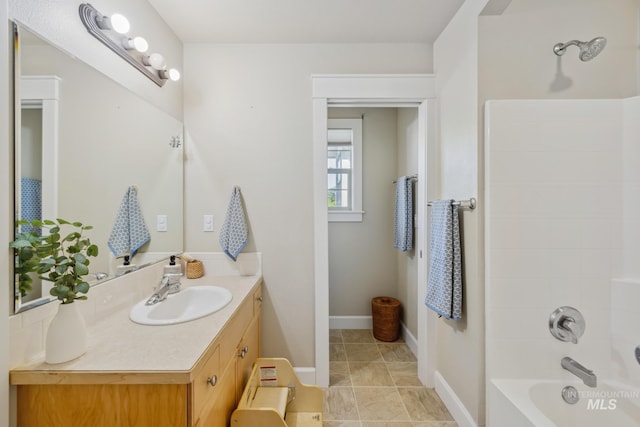 327 E Rockingham Dr, Eagle, ID 83616 - bathroom with vanity, shower / tub combination, and baseboards