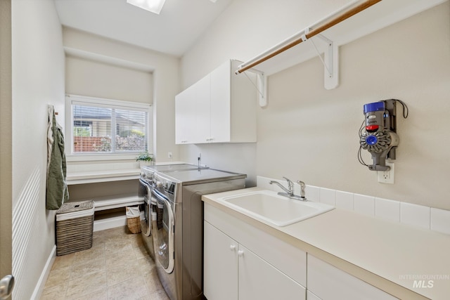 327 E Rockingham Dr, Eagle, ID 83616 - washroom with cabinet space, separate washer and dryer, baseboards, and light tile patterned floors