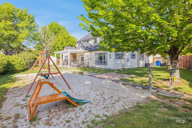 327 E Rockingham Dr, Eagle, ID 83616 - back of house with a playground and a patio area