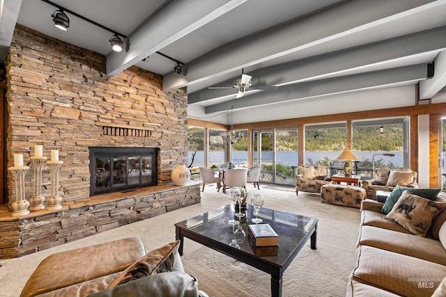 4076 Warren Wagon Rd, Mccall, ID 83638 - living room with carpet flooring, beamed ceiling, ceiling fan, track lighting, and a fireplace
