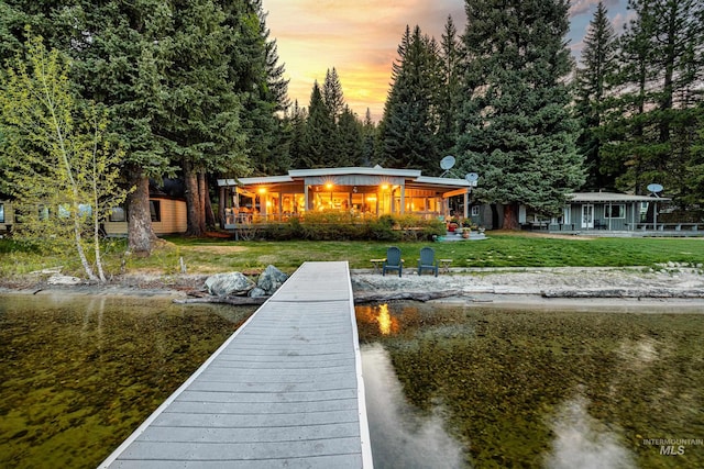 4076 Warren Wagon Rd, Mccall, ID 83638 - back of house at dusk featuring a yard