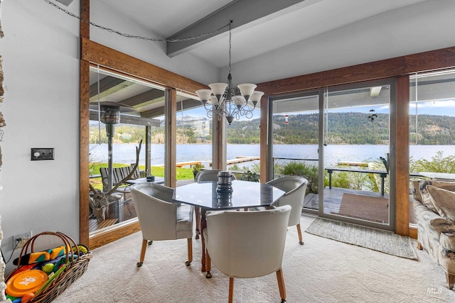 4076 Warren Wagon Rd, Mccall, ID 83638 - sunroom with a water view, a chandelier, and lofted ceiling
