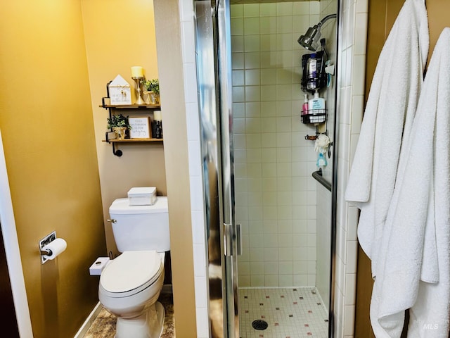 full bathroom featuring toilet and a stall shower