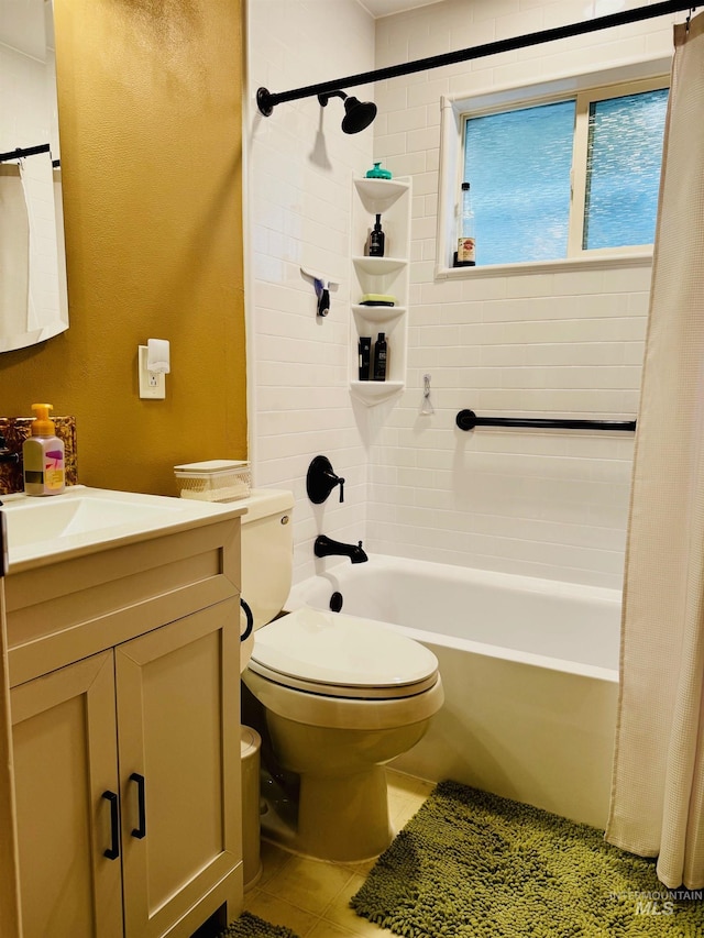 bathroom with shower / bath combo with shower curtain, vanity, toilet, and tile patterned floors