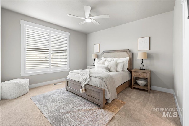 carpeted bedroom featuring ceiling fan