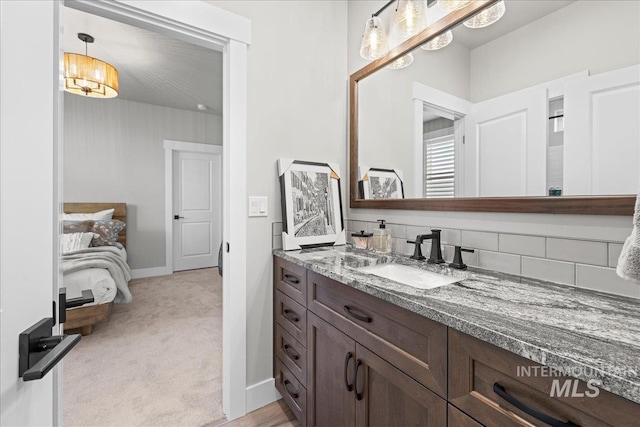 bathroom featuring backsplash and vanity