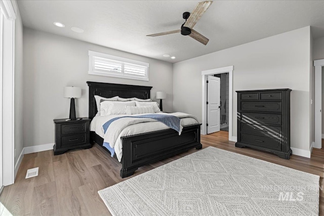 bedroom featuring ceiling fan and hardwood / wood-style floors