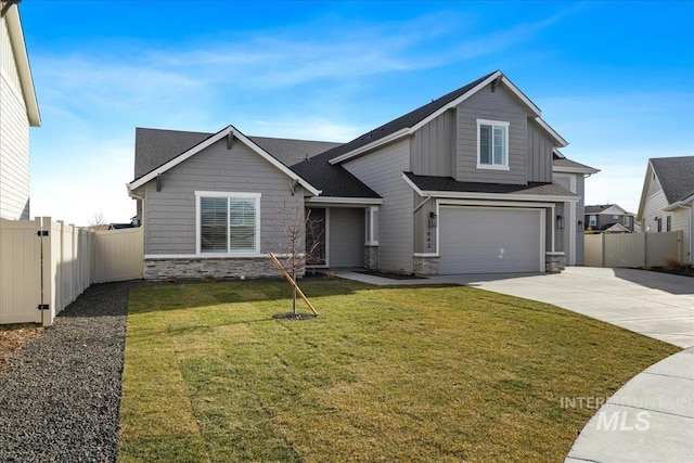 view of front of home with a garage and a front yard