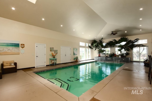 indoor pool featuring a ceiling fan