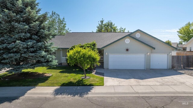 278 Trotter Dr, Twin Falls, ID 83301 - view of front of home with a garage, concrete driveway, and roof with shingles