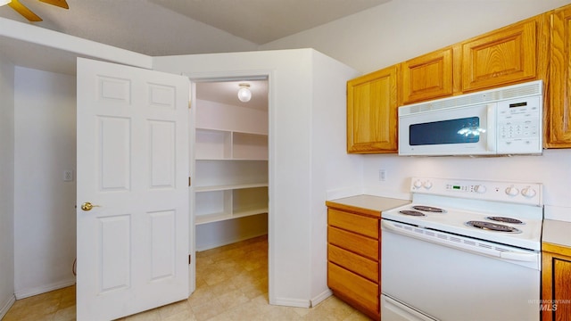 278 Trotter Dr, Twin Falls, ID 83301 - kitchen with white appliances, light countertops, a ceiling fan, and brown cabinetry
