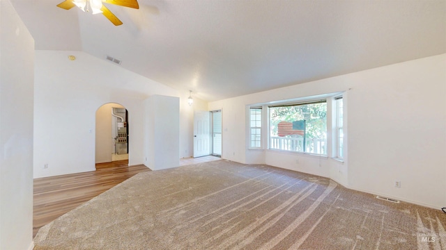 278 Trotter Dr, Twin Falls, ID 83301 - spare room with arched walkways, a ceiling fan, vaulted ceiling, and carpet flooring