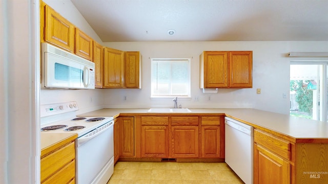 278 Trotter Dr, Twin Falls, ID 83301 - kitchen featuring white appliances, plenty of natural light, a peninsula, and light countertops
