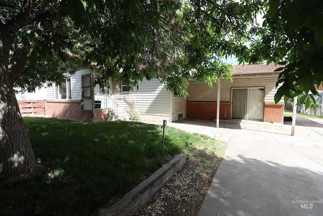 view of home's exterior featuring a yard