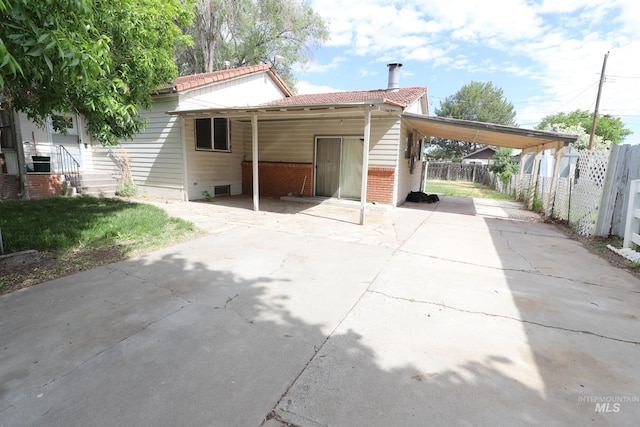 exterior space featuring a carport