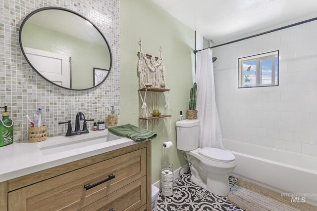 bathroom with tasteful backsplash, shower / bathtub combination with curtain, toilet, vanity, and tile patterned floors