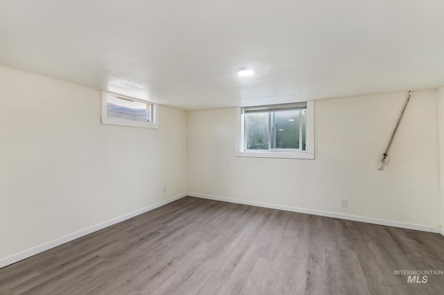 basement with wood finished floors and baseboards