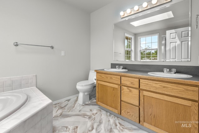 2943 S Zach Pl, Boise, ID 83706 - full bathroom featuring double vanity, a skylight, tiled tub, toilet, and marble look tiles