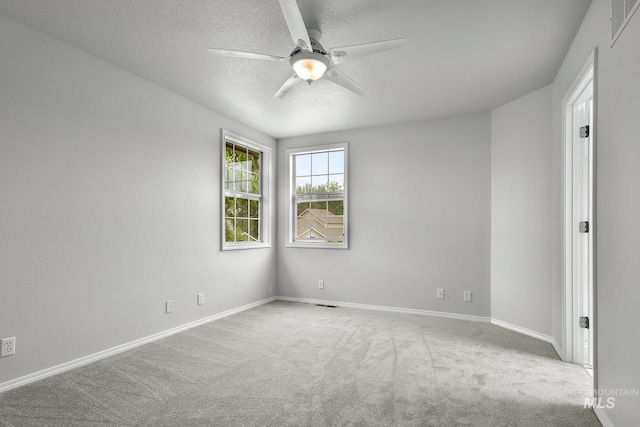 2943 S Zach Pl, Boise, ID 83706 - spare room featuring carpet floors, ceiling fan, baseboards, and a textured ceiling
